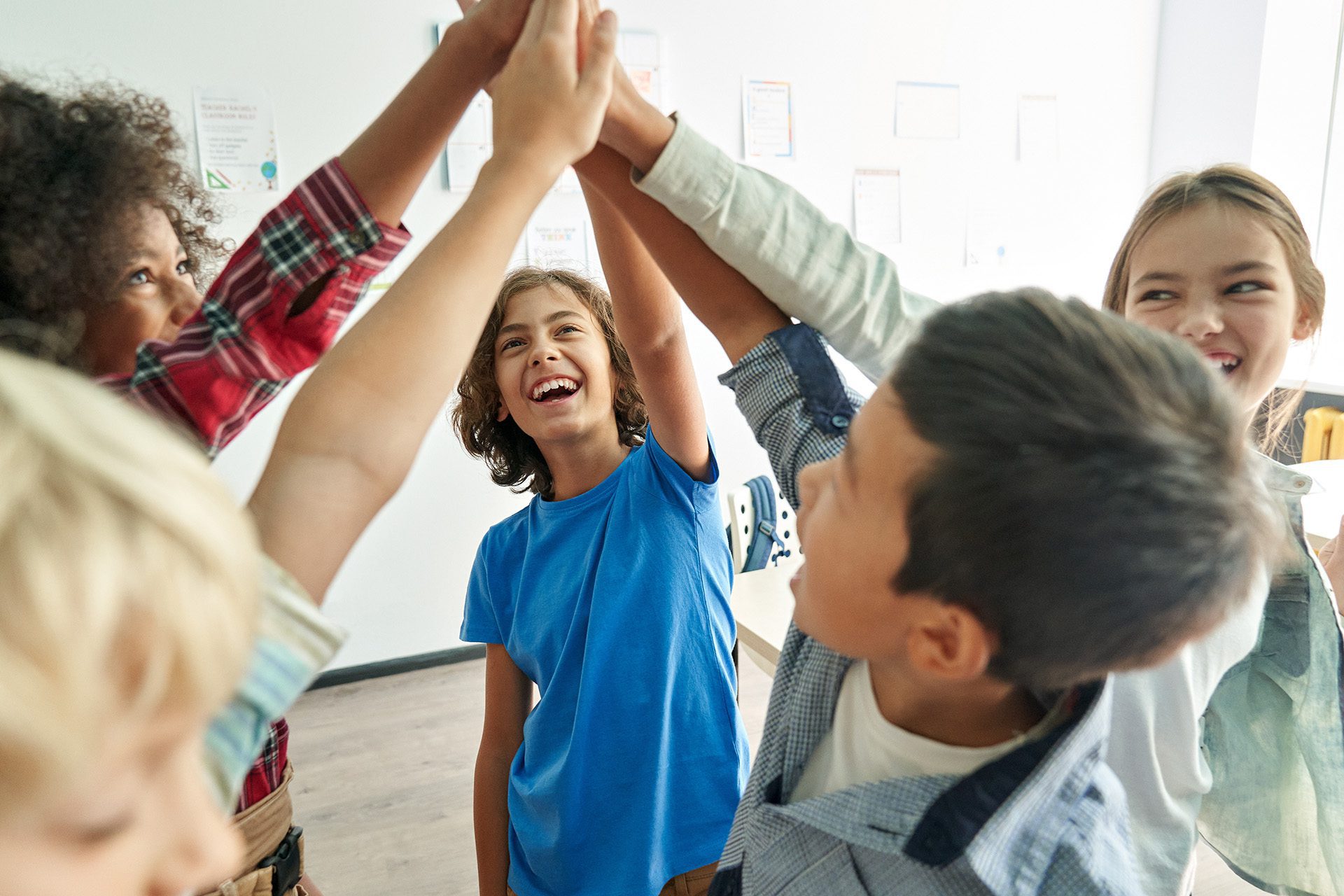 Excited Students Group Highfive jpg